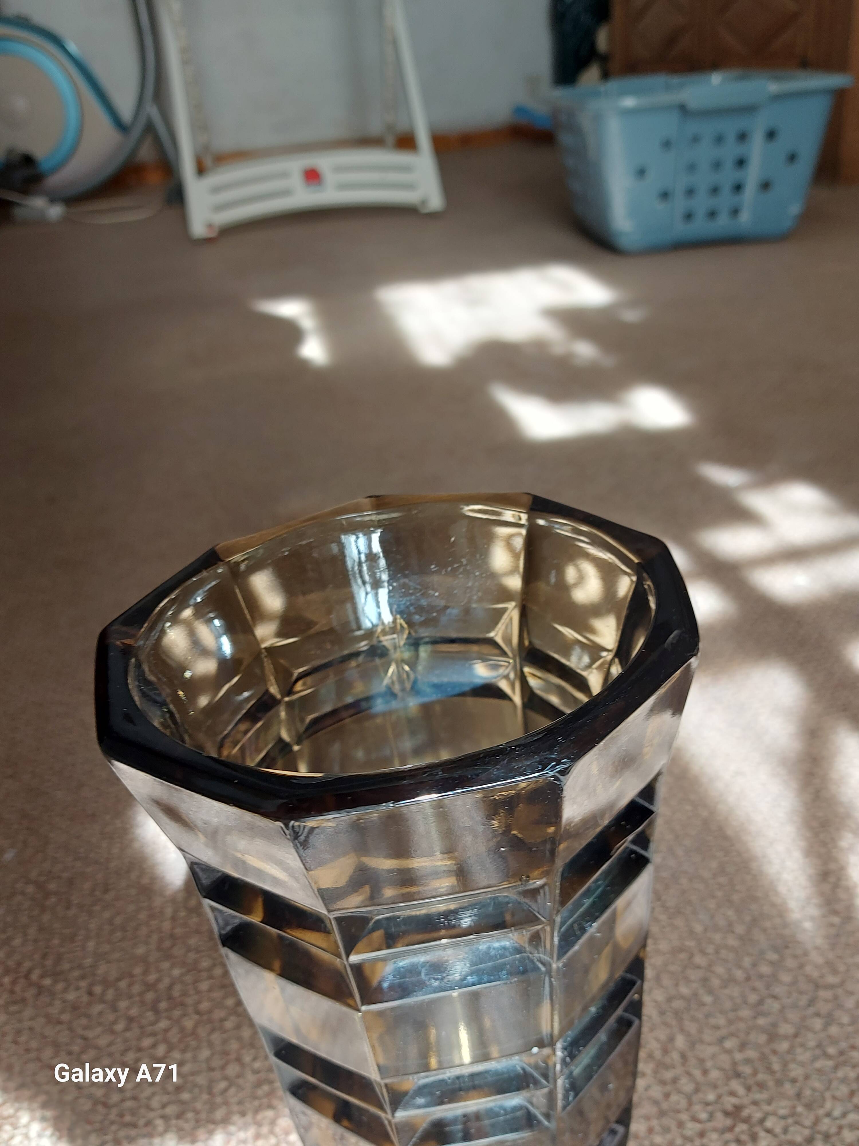 Large brown Art Deco vase with cut facets.