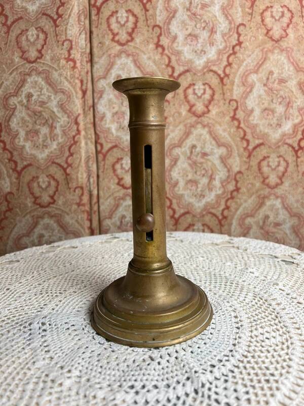 Patinated gilt brass candlestick