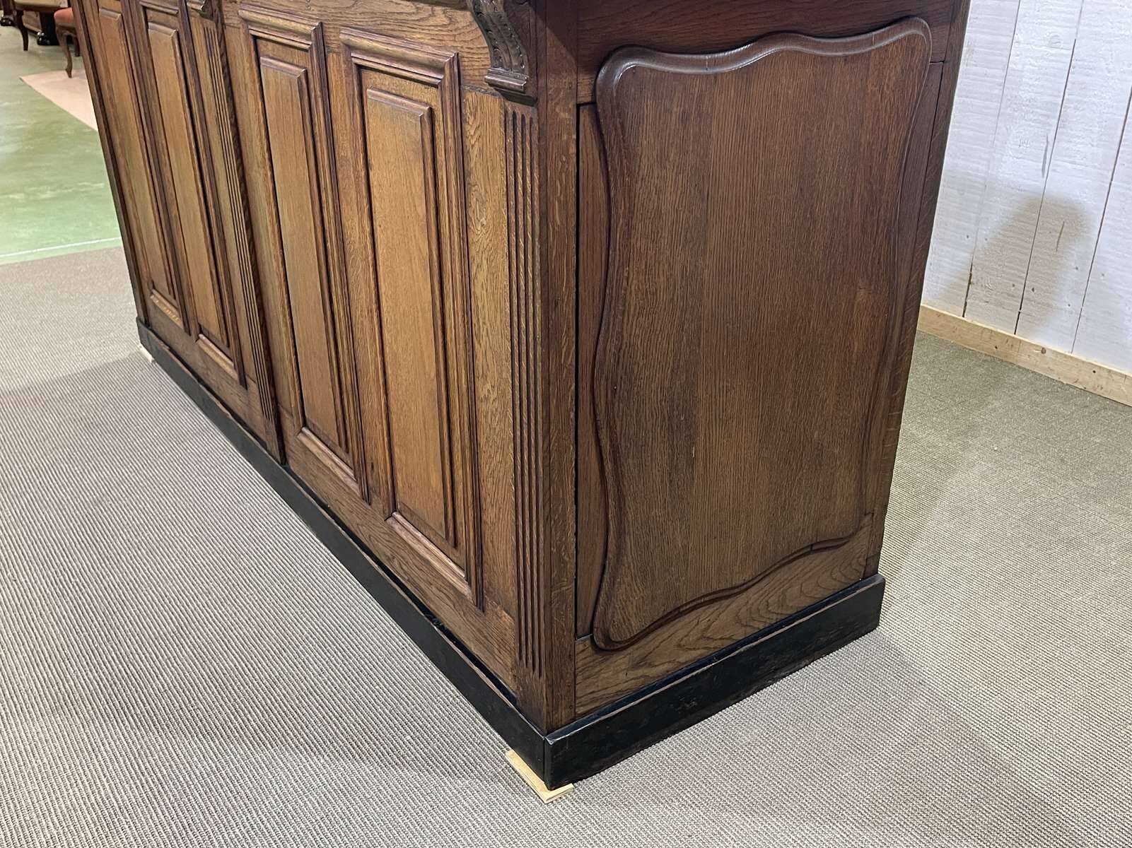 Bar counter in oak, zinc, and white marble from the early 20th century.