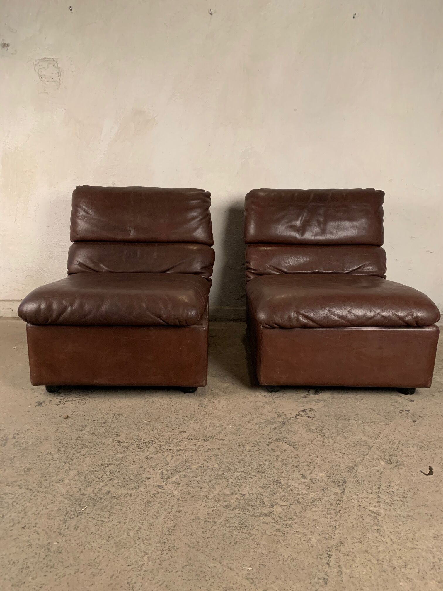 A pair of leather armchairs, Switzerland, 1970s