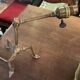 Rare articulated tripod base table lamp in gold-plated brass