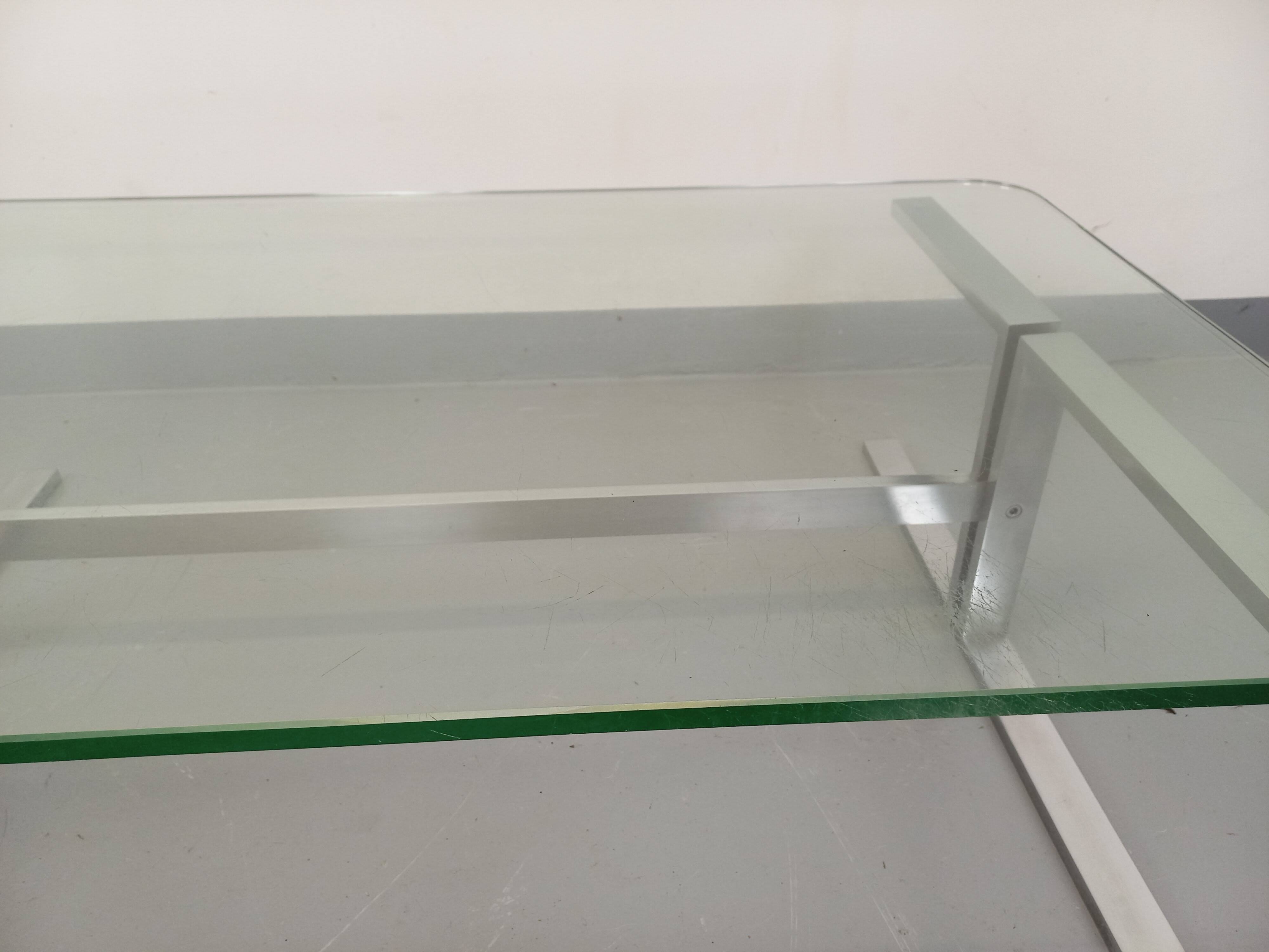 Vintage coffee table in transparent glass and cast aluminum from the 70s