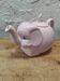 Antique pink elephant teapot in earthenware.