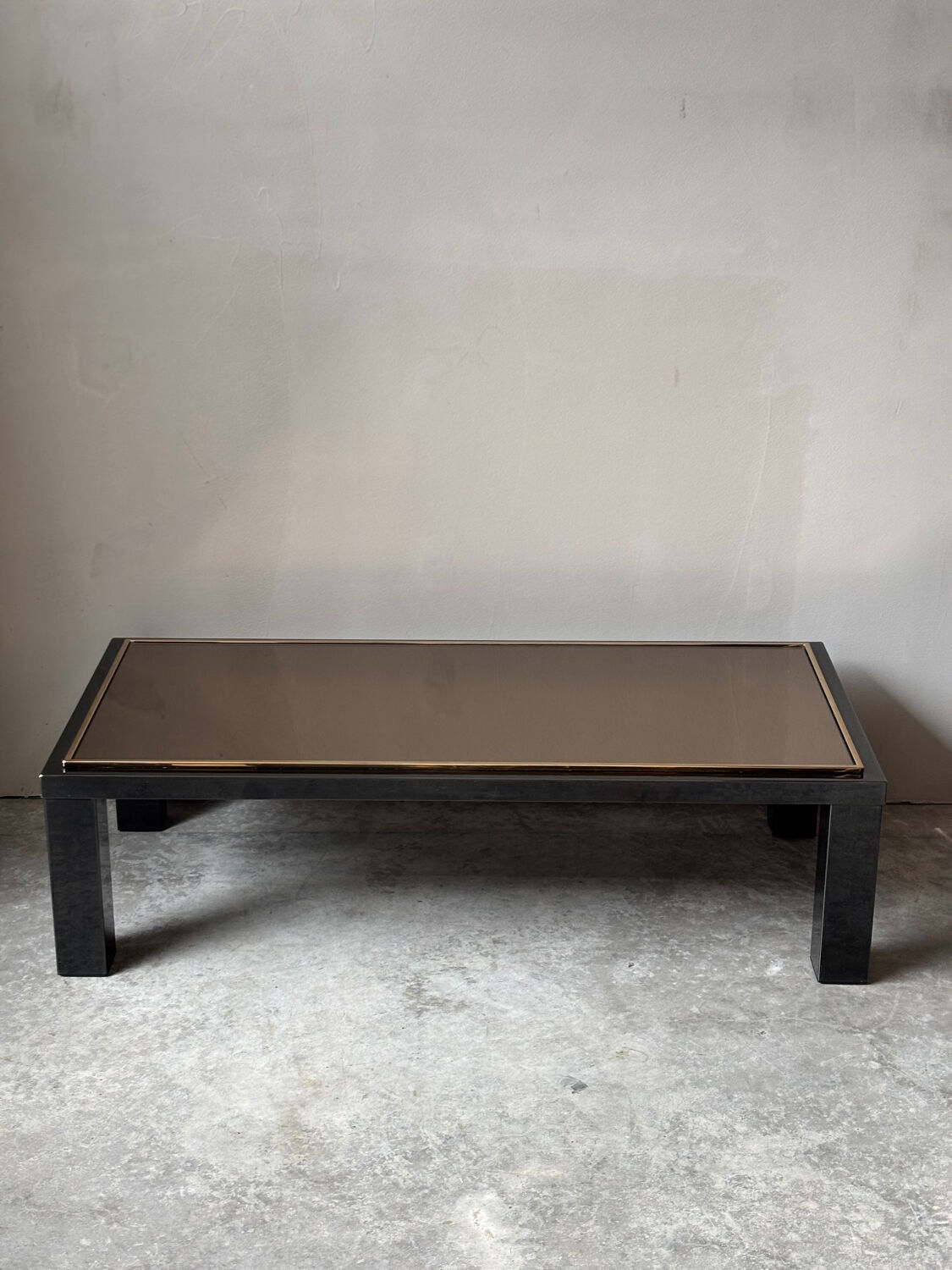 Large Belgochrom coffee table in gold and smoked glass.