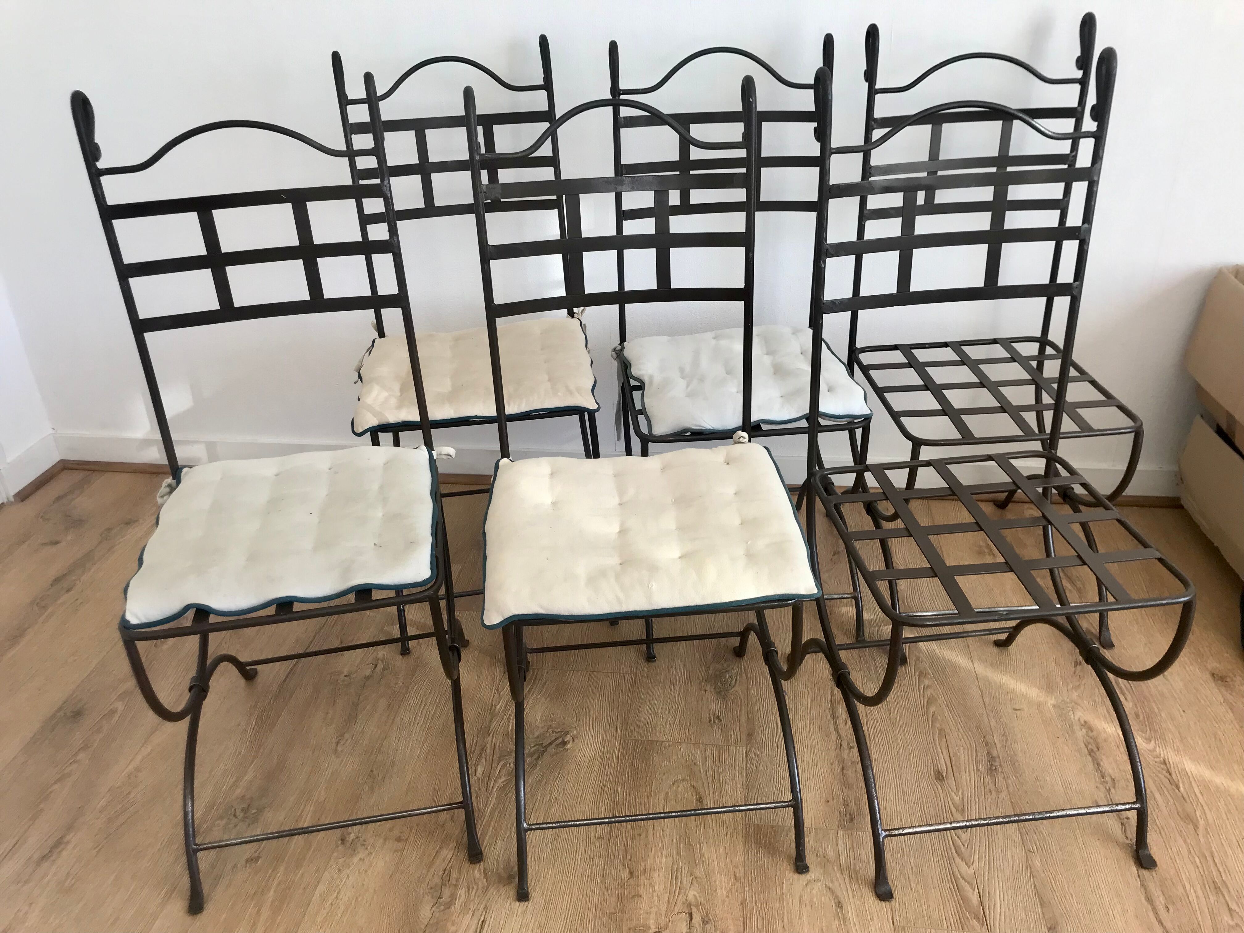 Six wrought iron chairs
