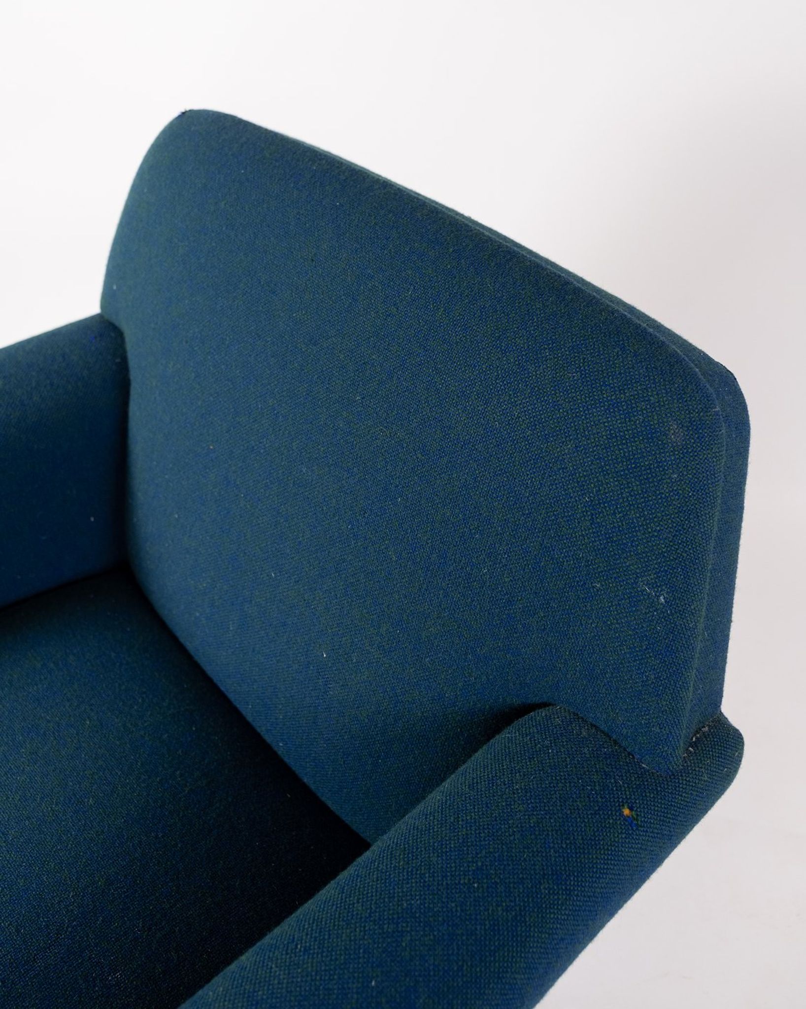 Armchair upholstered with dark blue wool fabric and legs in dark wood, of danish design, 1960s