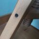 Tripod stool with a screw.