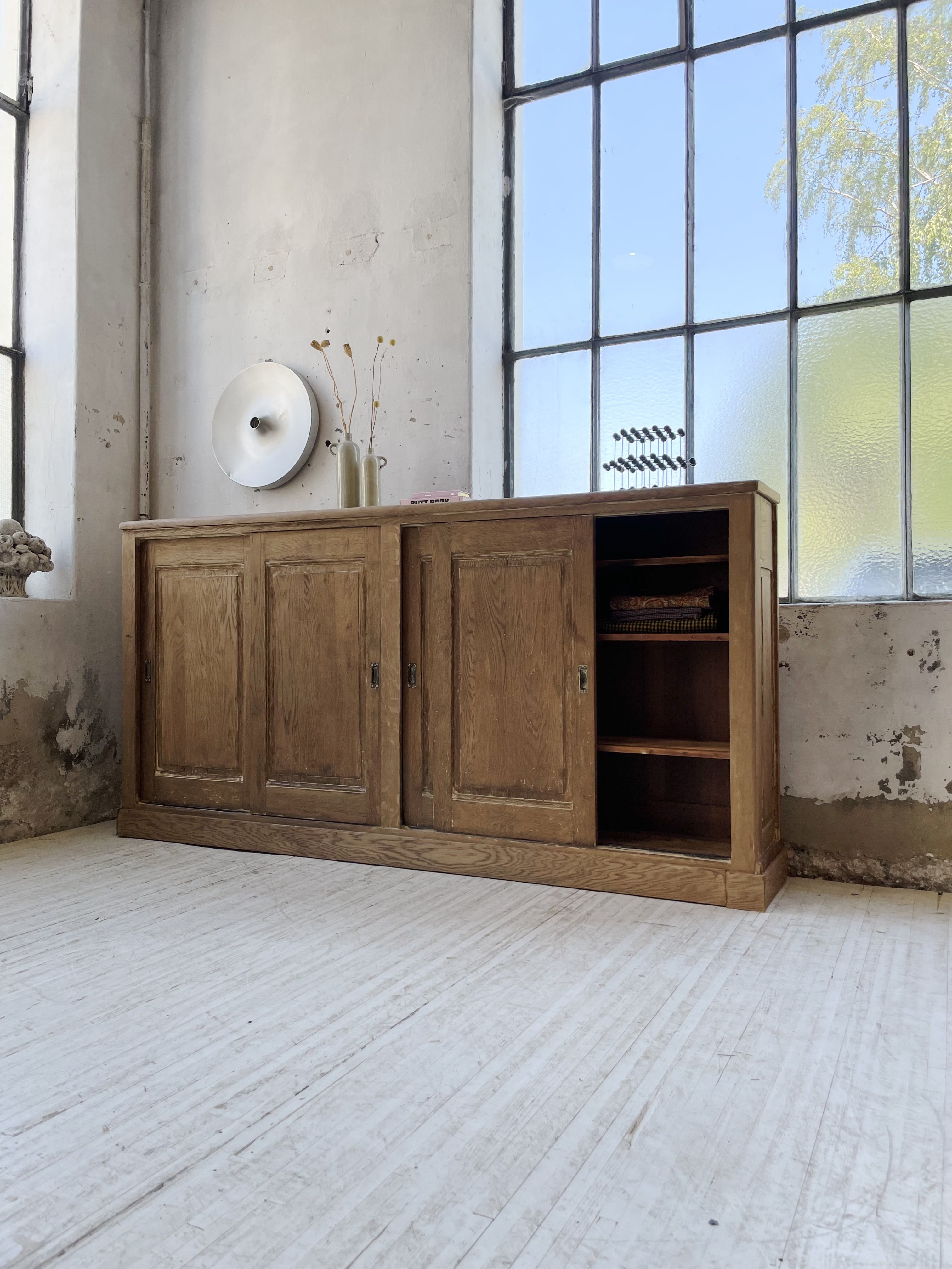 Large row of solid oak loom sliding doors