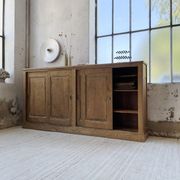 Large row of solid oak loom sliding doors