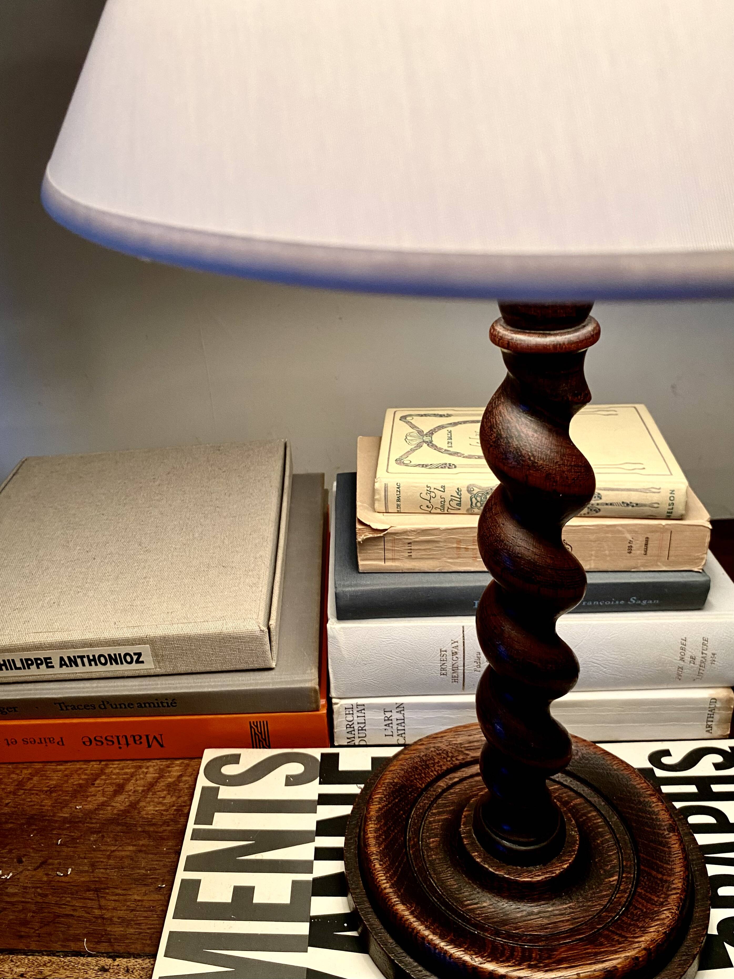 Turned wooden lamp base, fabric cable