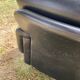 Pair of black imitation leather armchairs
