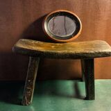 Antique milking stool in rustic curved wood, 19th century