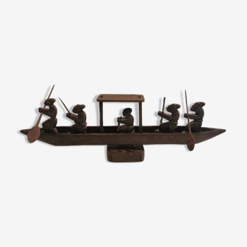 Old African wooden boat with figures