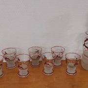 Glasses and carafe decorated with red Christmas reindeer and white granita 60's
