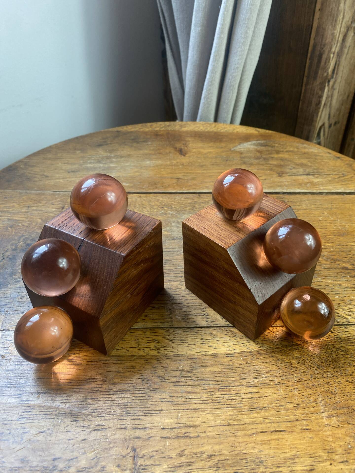 Wooden bookends and spherical glass balls