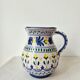 Vintage ceramic pitcher/vase hand-painted with floral decoration.