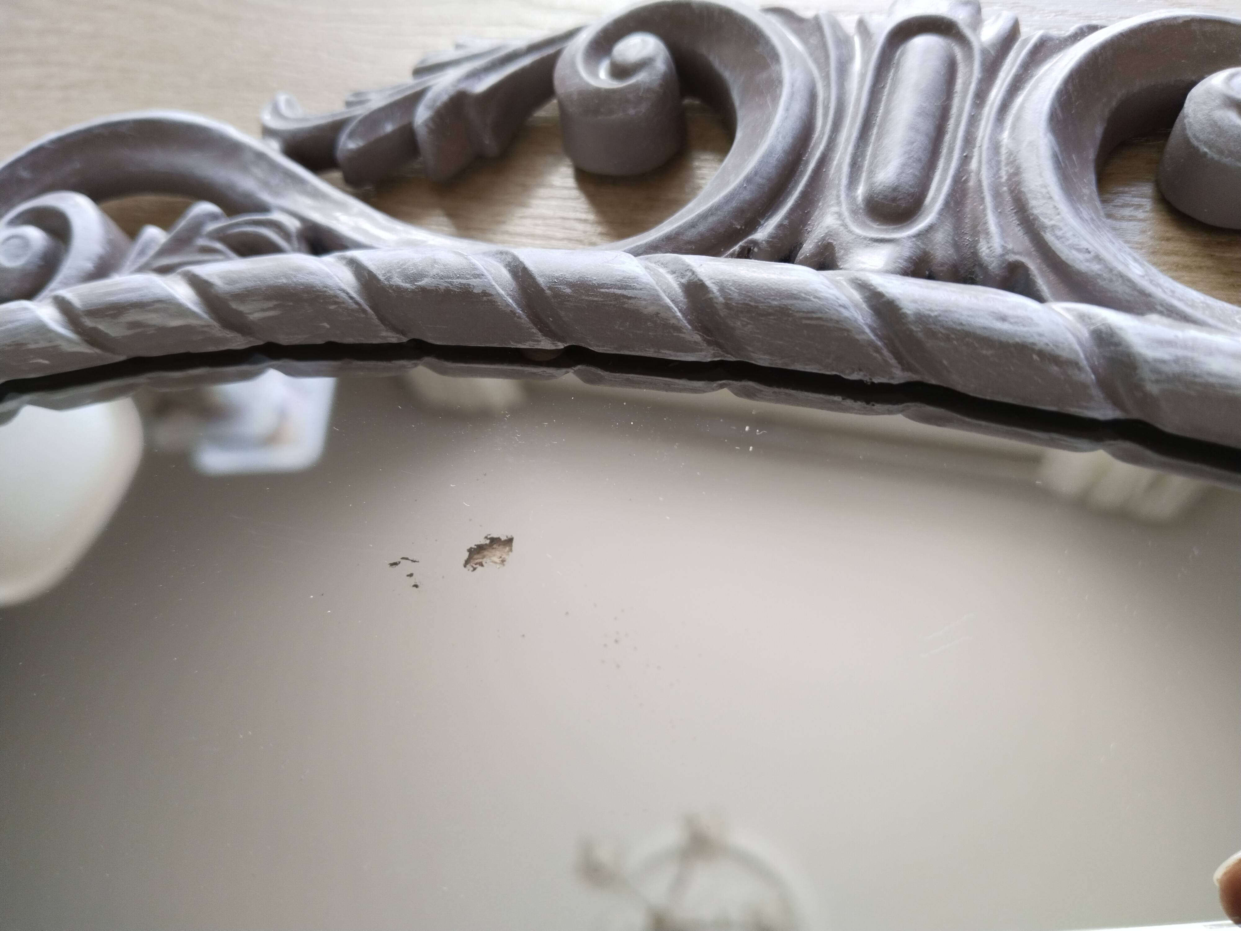 Louis XVI style patinated oval mirror