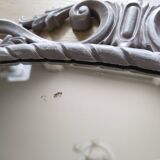 Louis XVI style patinated oval mirror