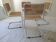 B32 chairs by Marcel Breuer in white.