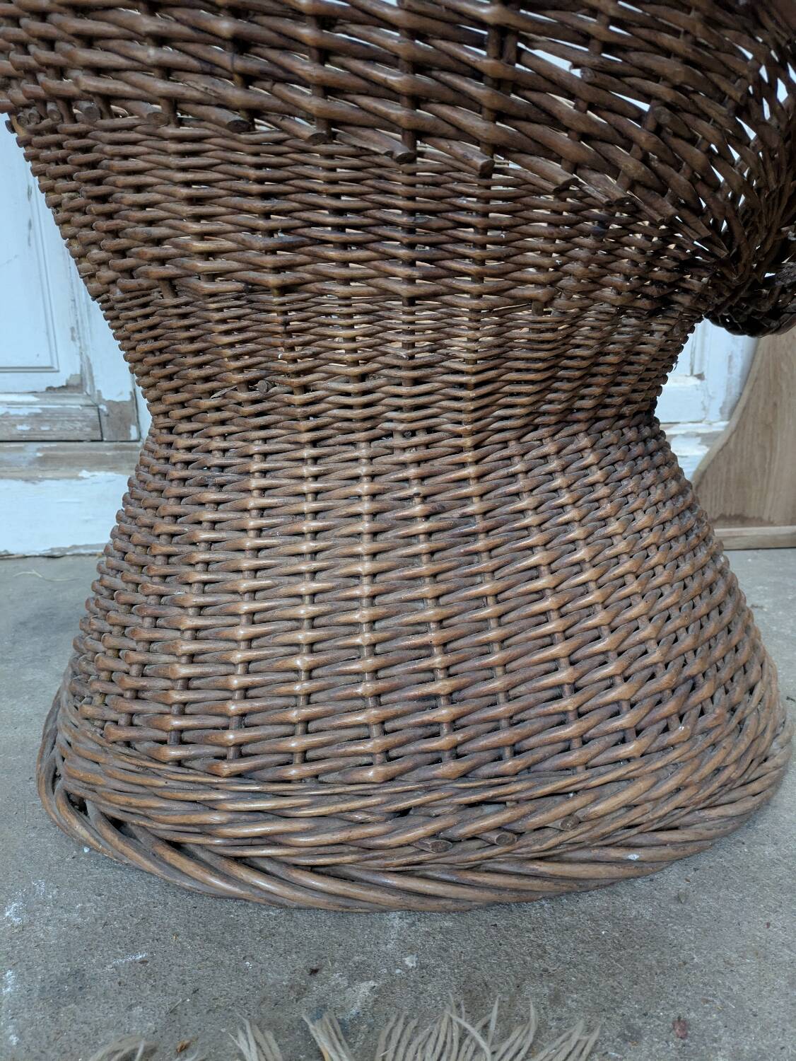 Large woven rattan armchair