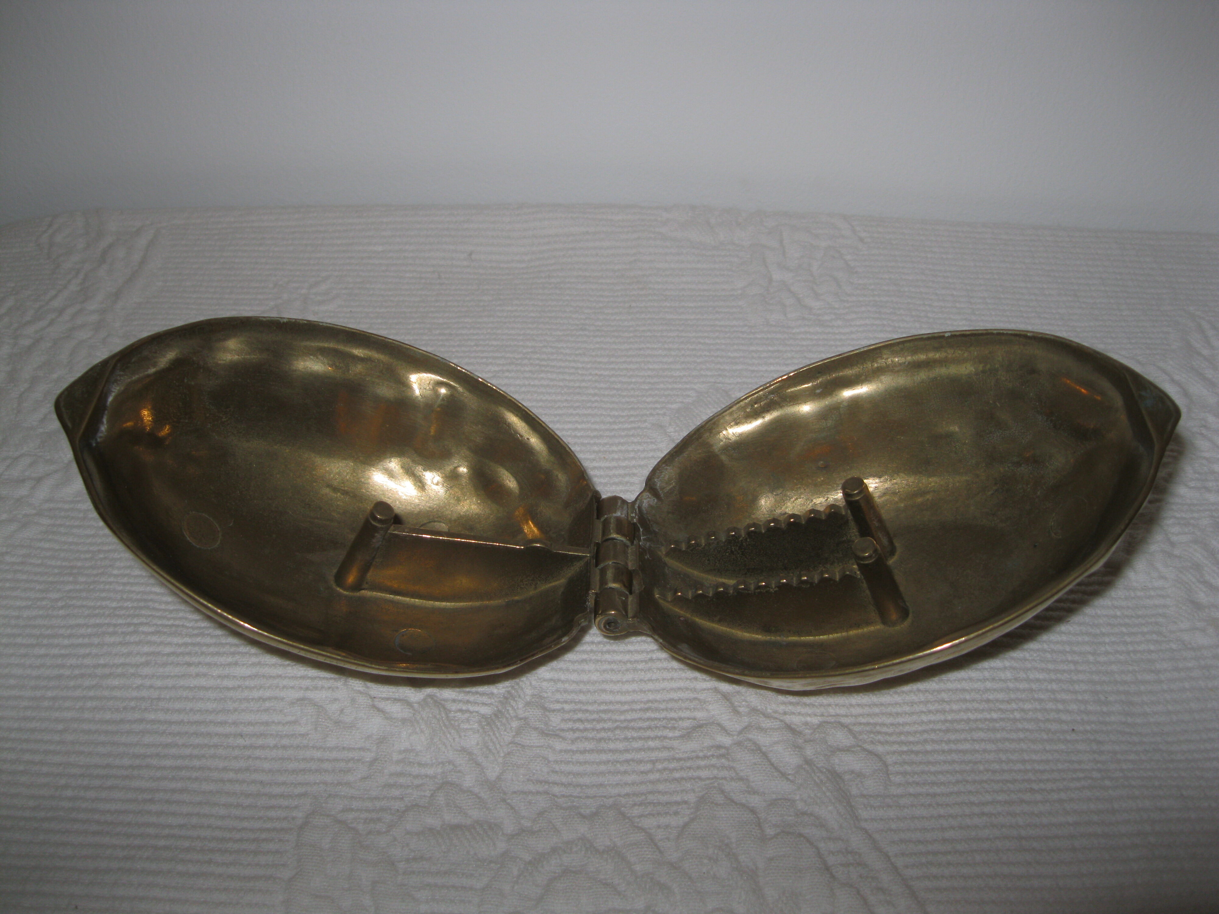 Nut-shaped brass nutcracker