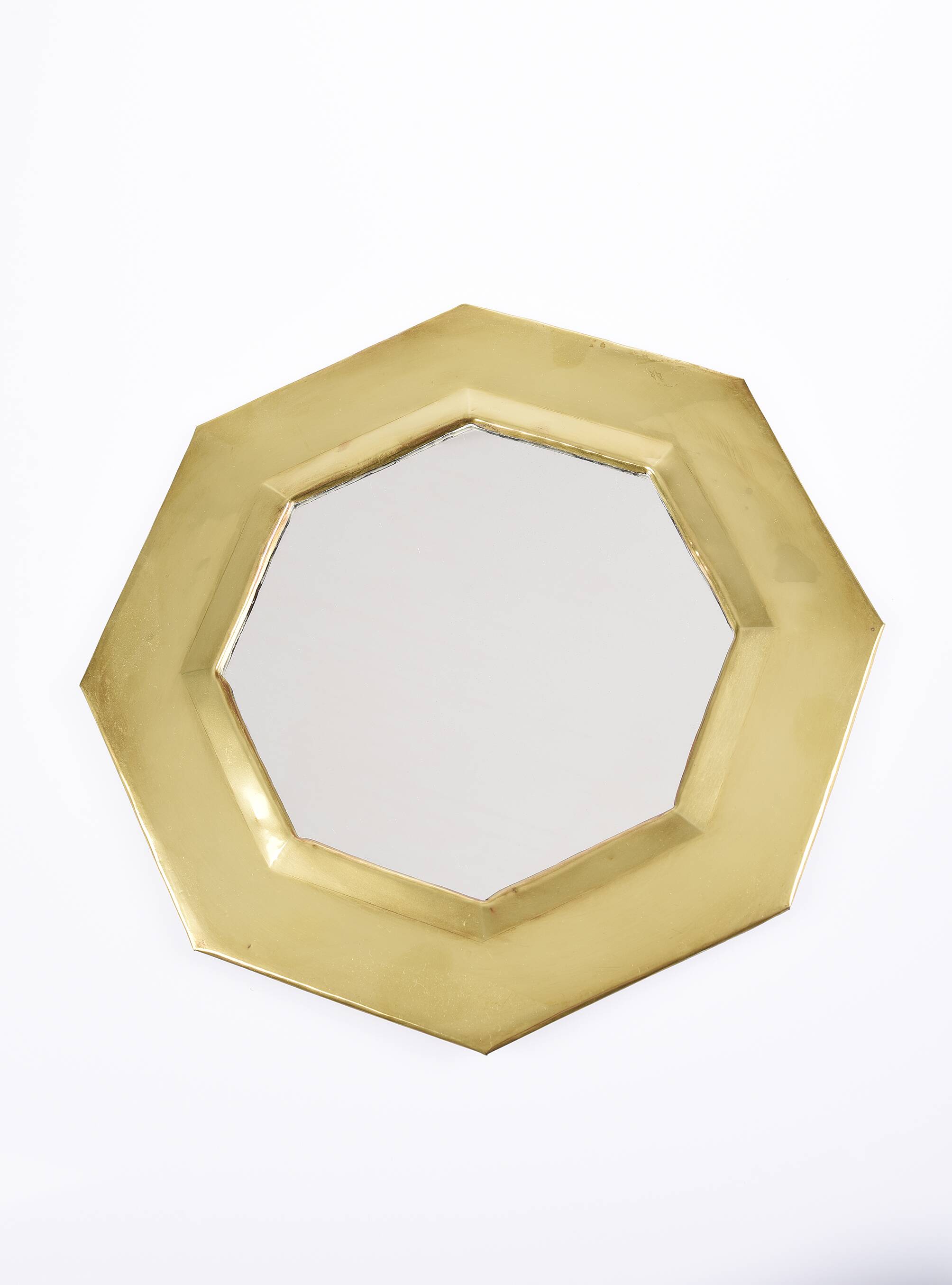 Old golden octagonal mirror, in brass