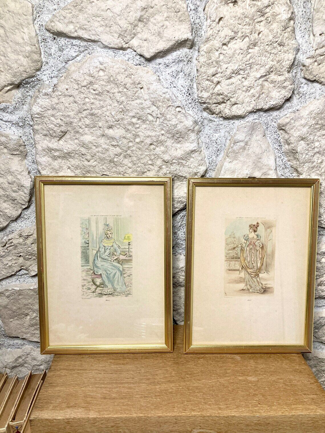 Set of two framed mode engravings