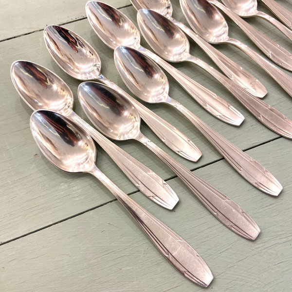 Series of 14 Art Deco dessert spoons, silver metal