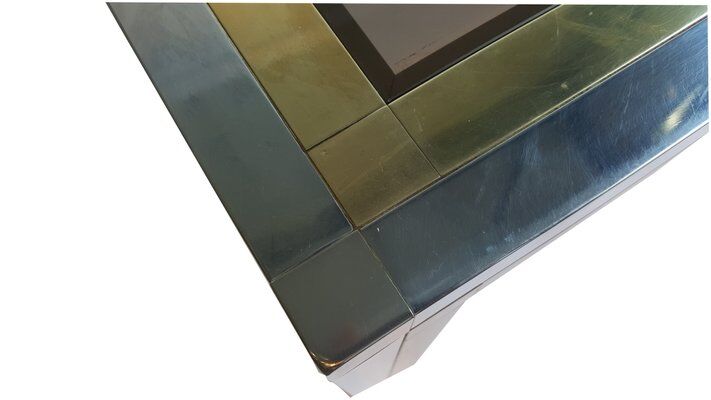 Coffee table in chromed metal and brass