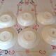 Six white hollow plates on board yellow Monaco 60
