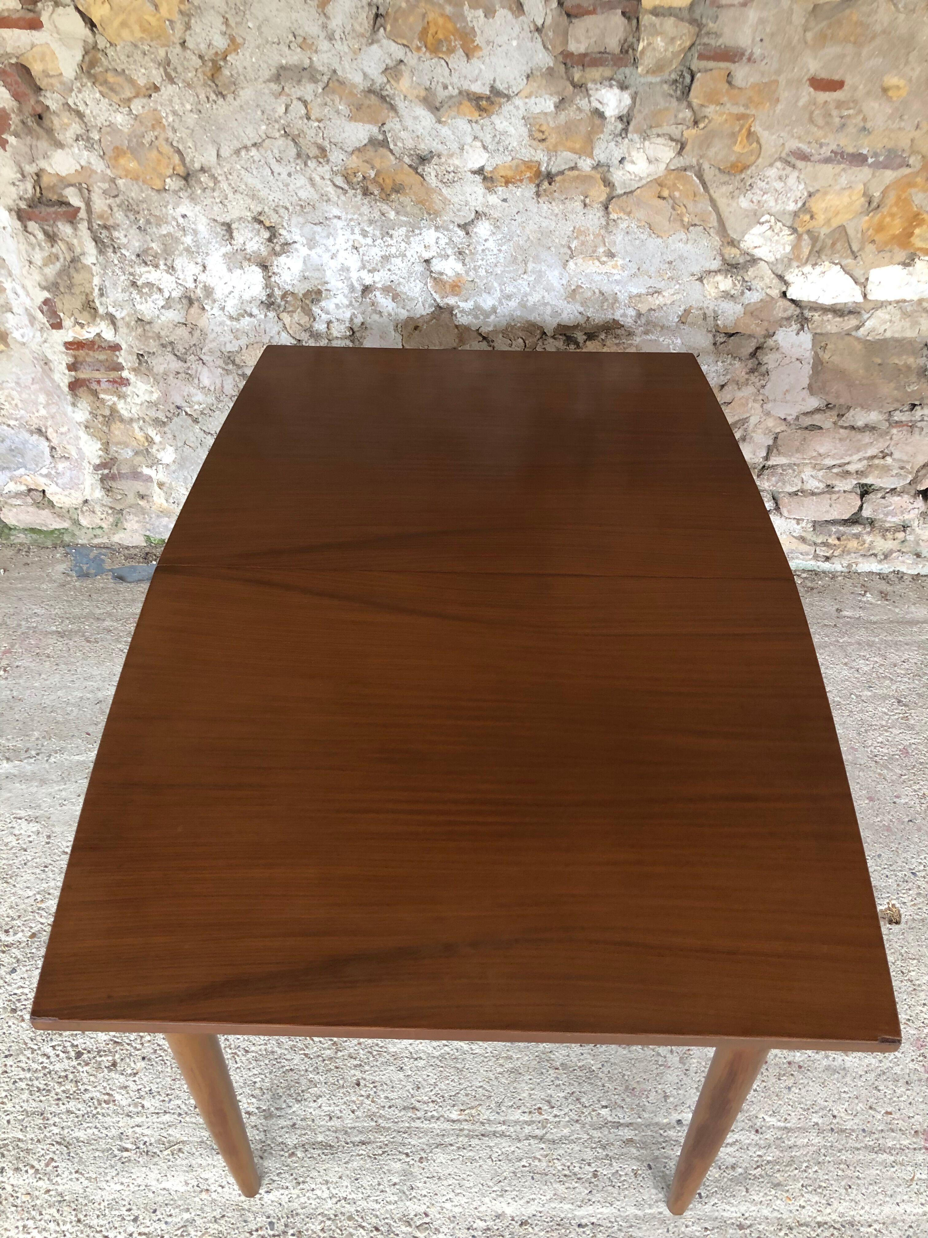 Scandinavian extension teak stretch table in butterfly ephardt by Meredew circa 60's
