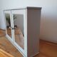Greyed wood medicine cabinet