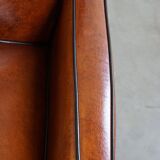Cognac-colored sheepskin Art Deco design armchair in good condition