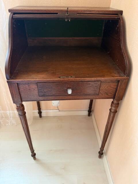 Pretty little secretary with a curtain.