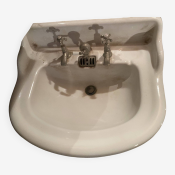 Old white earthenware sink