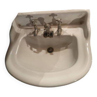 Old white earthenware sink