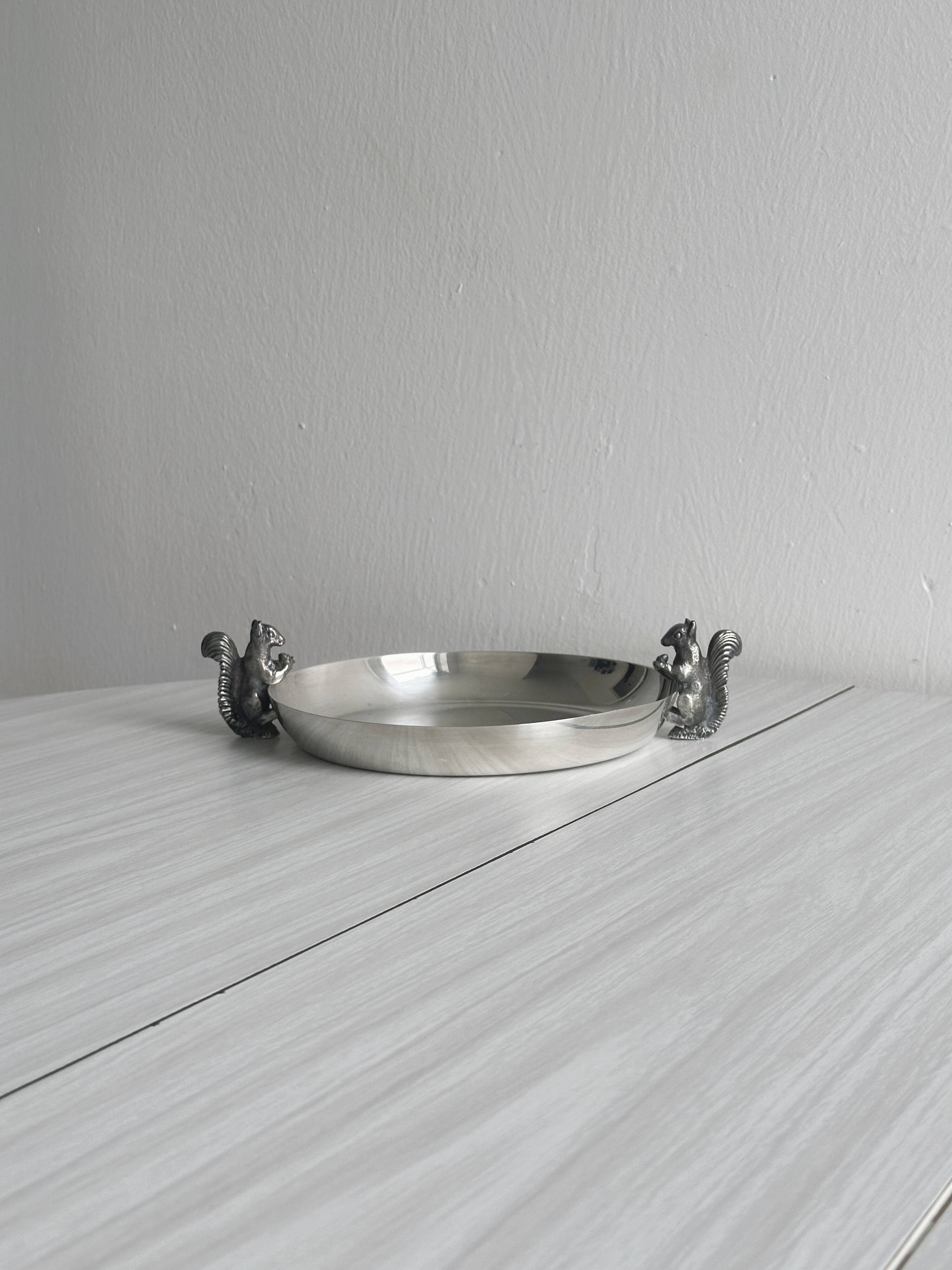 Small shiny silver metal dish