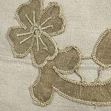 Cushion in vintage fabric with ornamentation