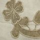 Cushion in vintage fabric with ornamentation.