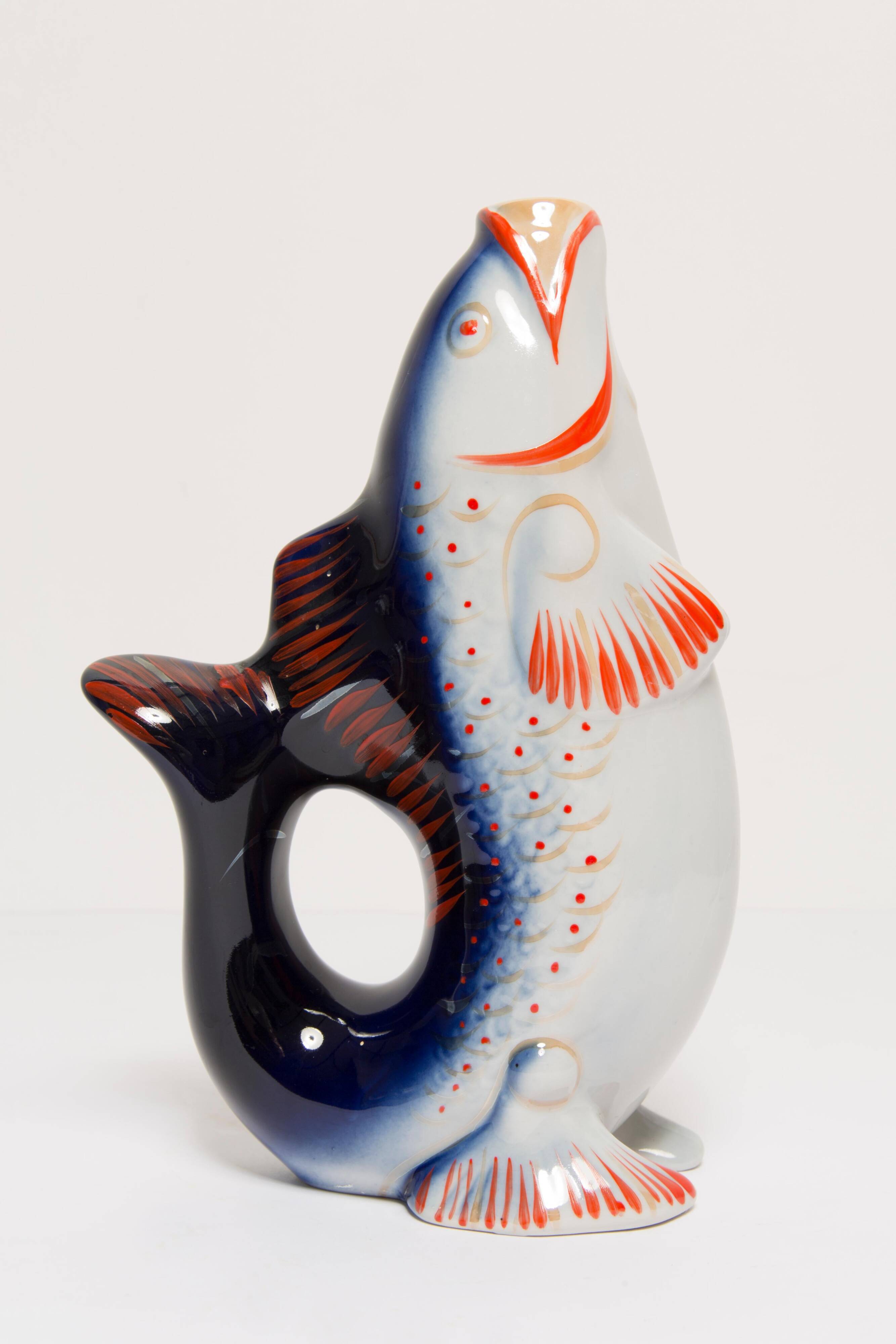 Set of 7 blue glass fish, mid-20th century.