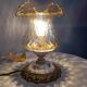 Baroque inspired table lamp, bronze, ceramic flowers and glass globe