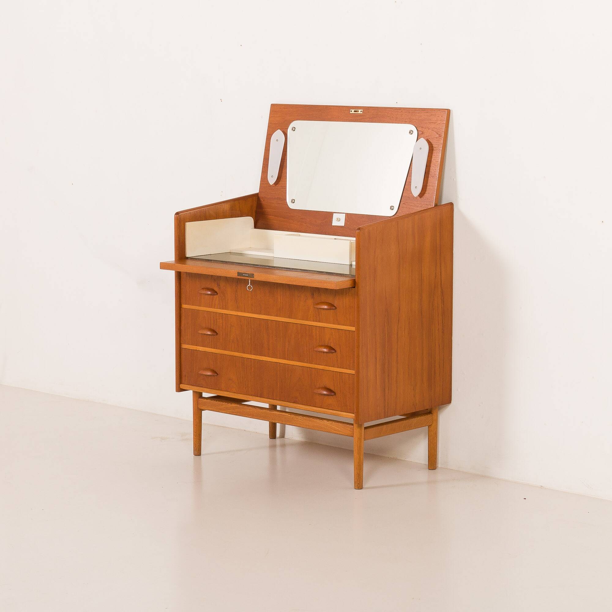 Danish teak dresser with hidden vanity and lights, 1960s