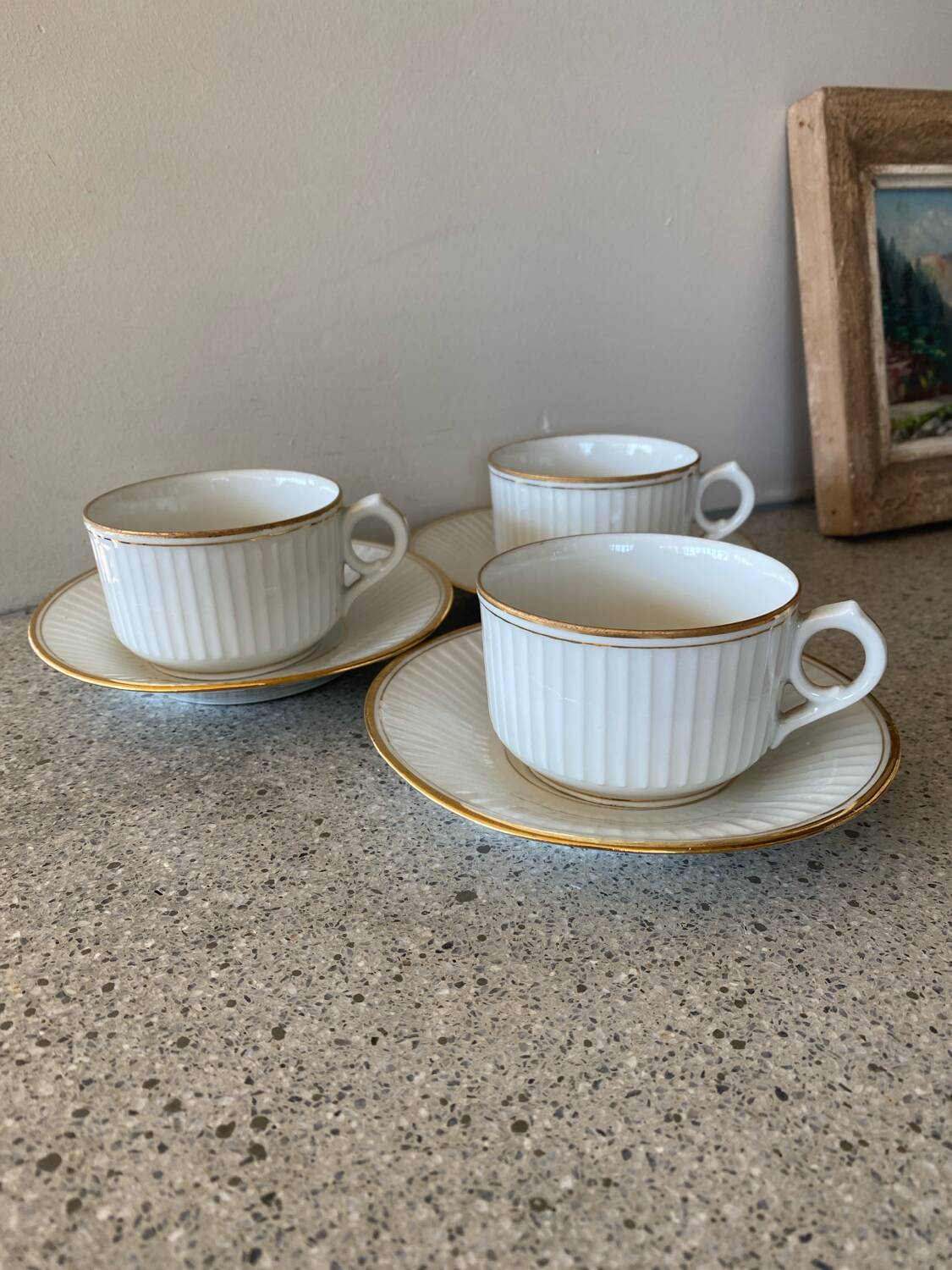 3 white and gold tea or chocolate cups