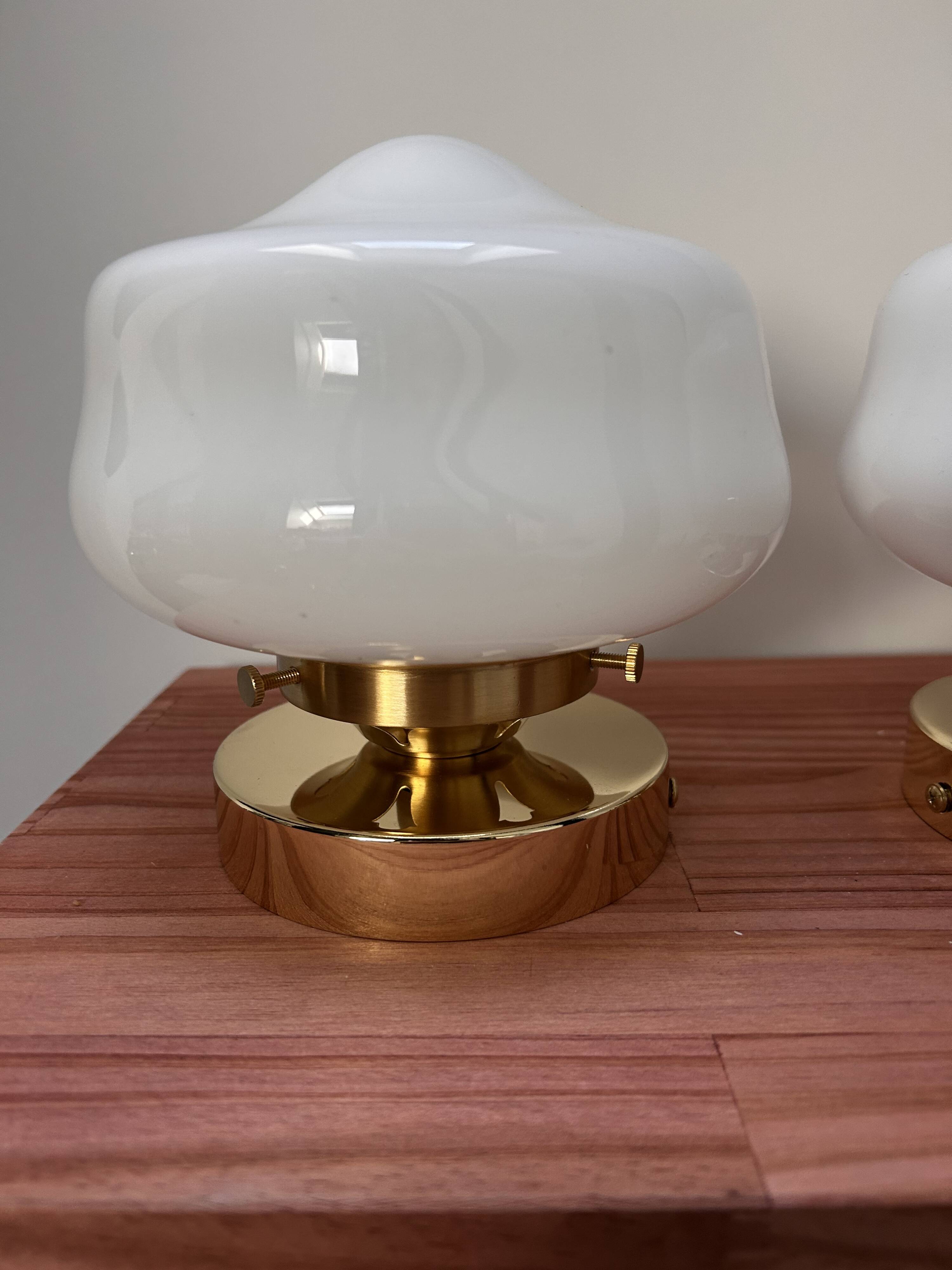 Pair of white opaline globe wall lights