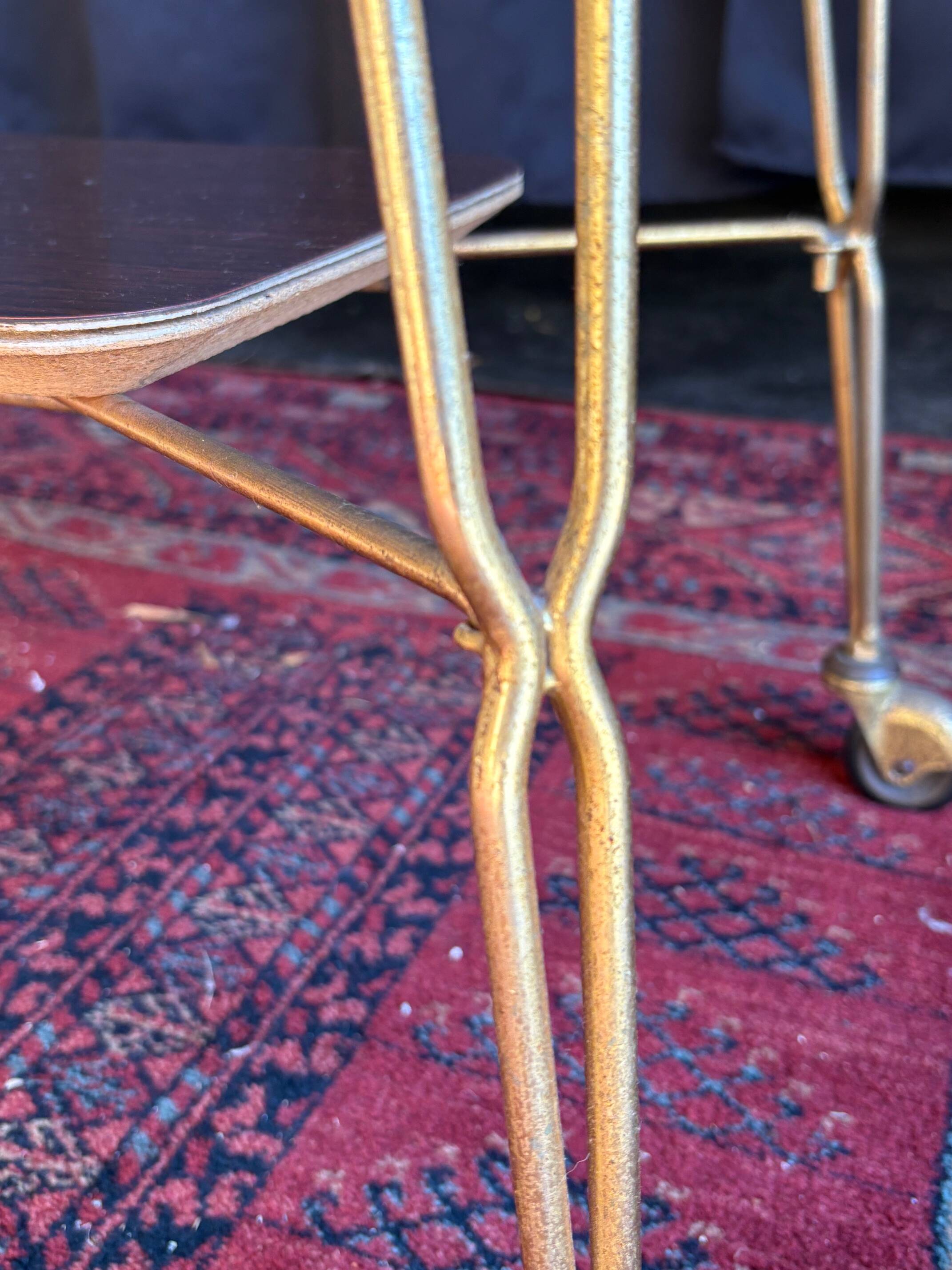 Vintage 1960s rolling dessert trolley in gold metal and formica.