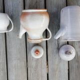 Trio of sandstone pitcher teapots