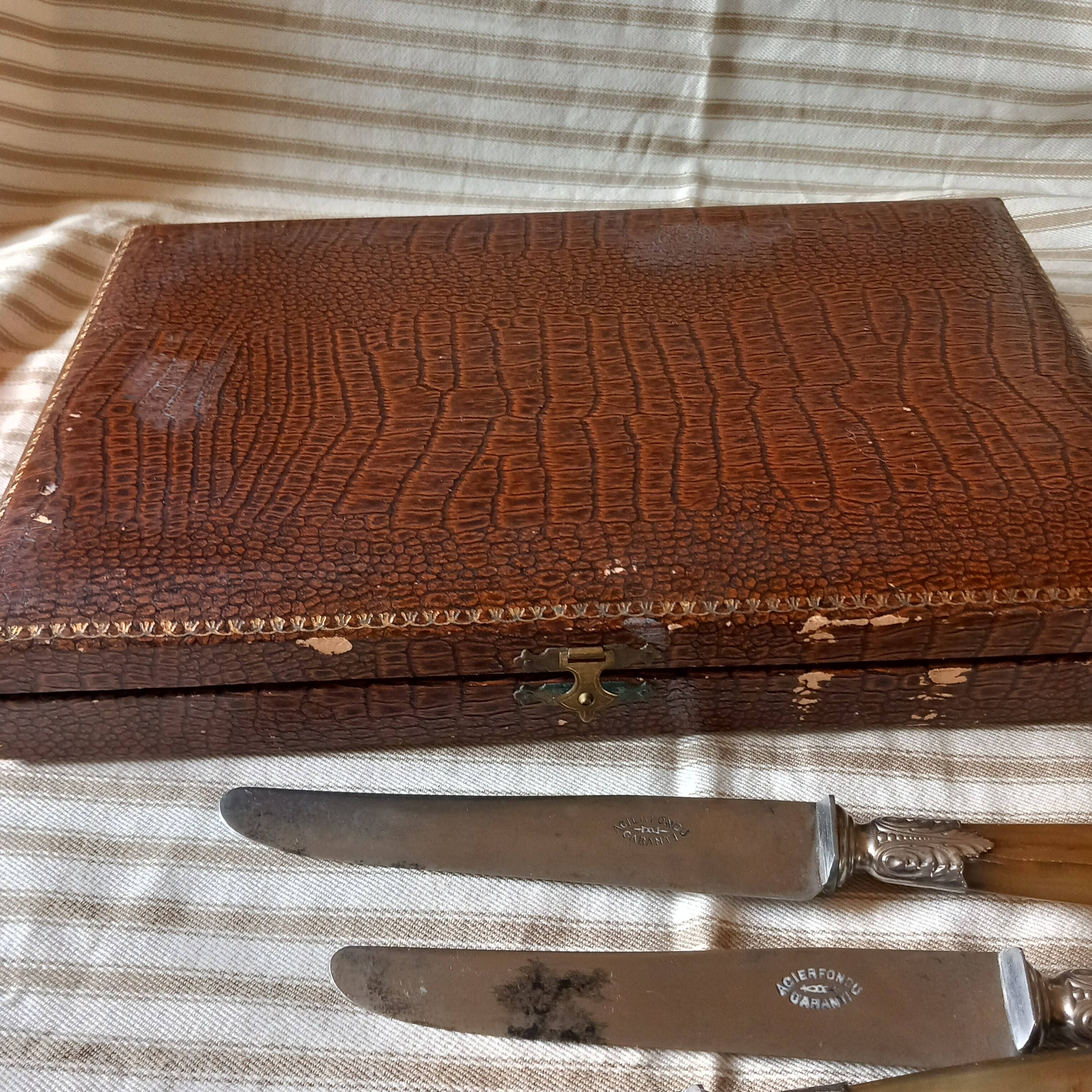 Box of 12 old cast steel knives