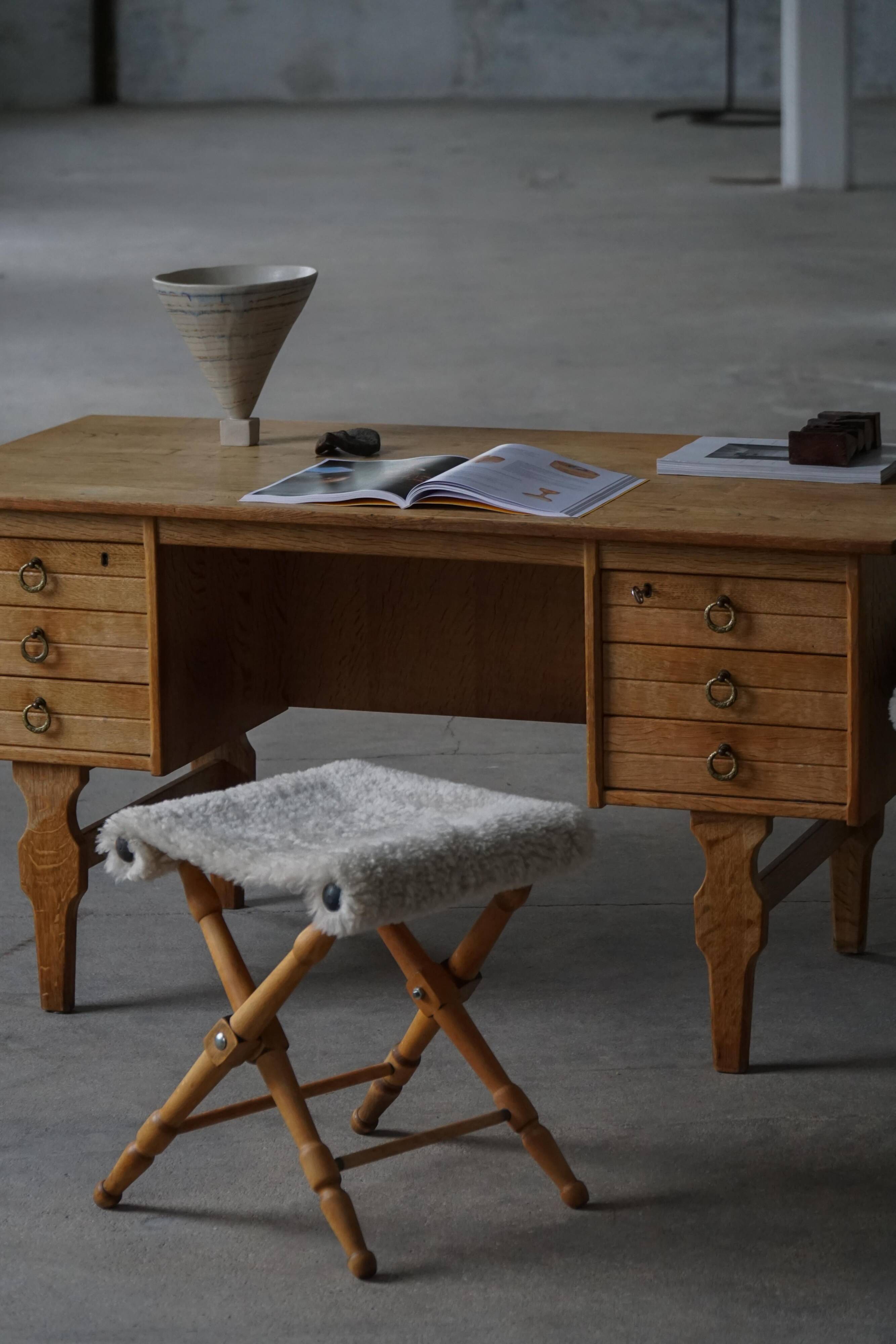 Pair of Danish mid-century folding stools with sheepskin upholstery, 1960.
