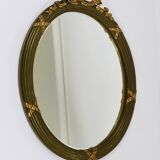 Faceted wall mirror in neoclassical Gustavian style, oval, in gilded wood, Italy, 1900s.