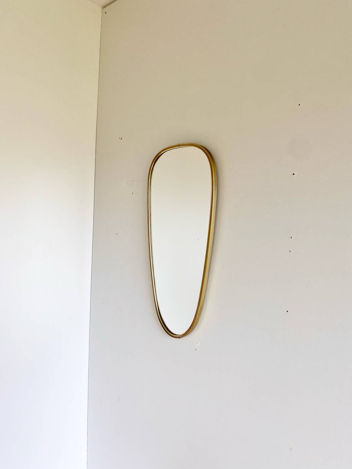 Vintage brass mirror in rear-view mirror shape